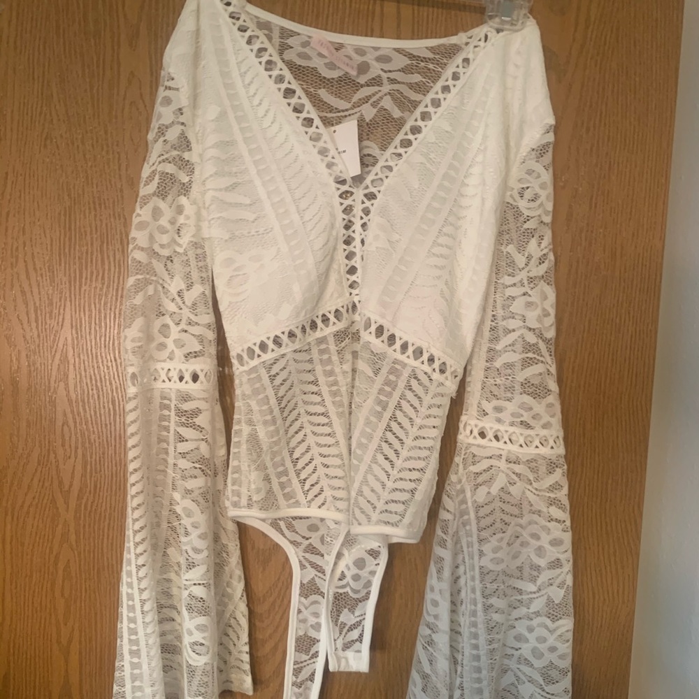White long bell sleeve lace body suit!